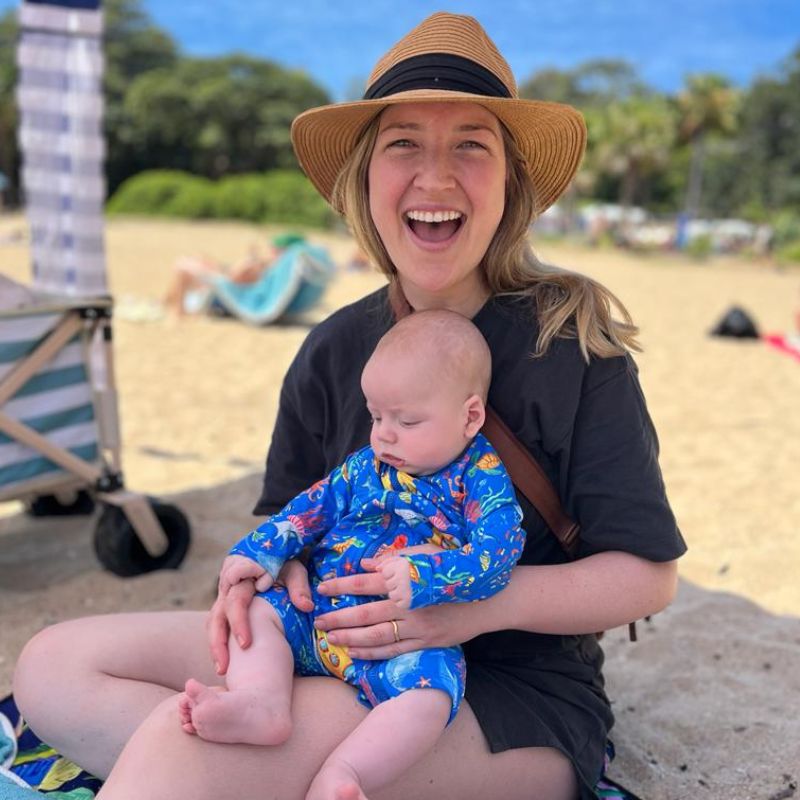 mum & son on beach wearing ocean tales