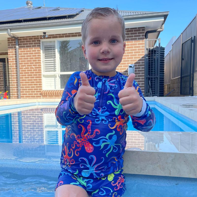 boys wearing ocean tales at his pool